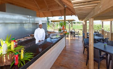 a chef standing at a bar