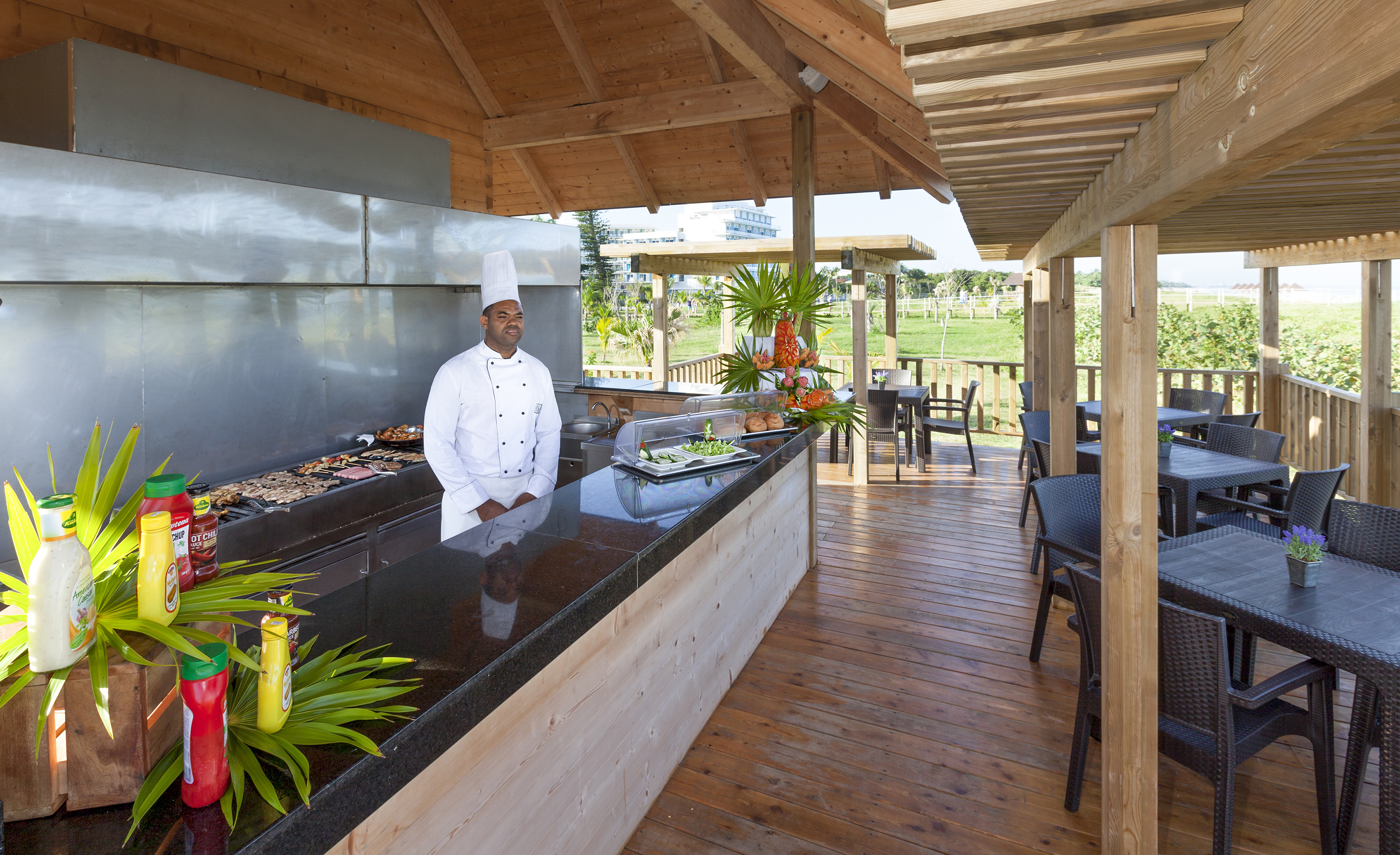a chef standing at a bar