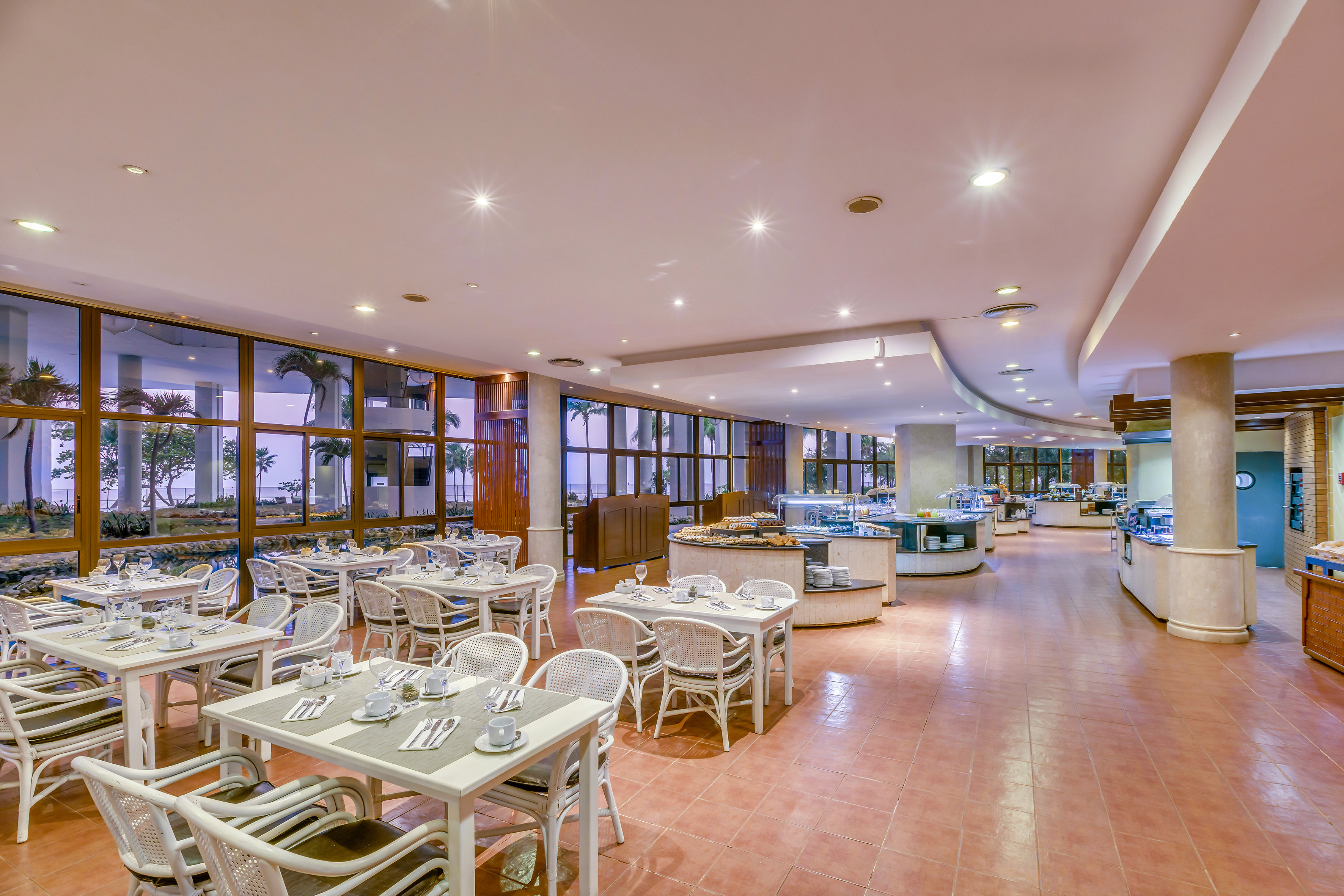 a restaurant with tables and chairs