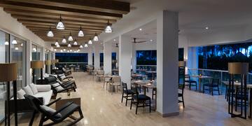 a room with chairs and tables