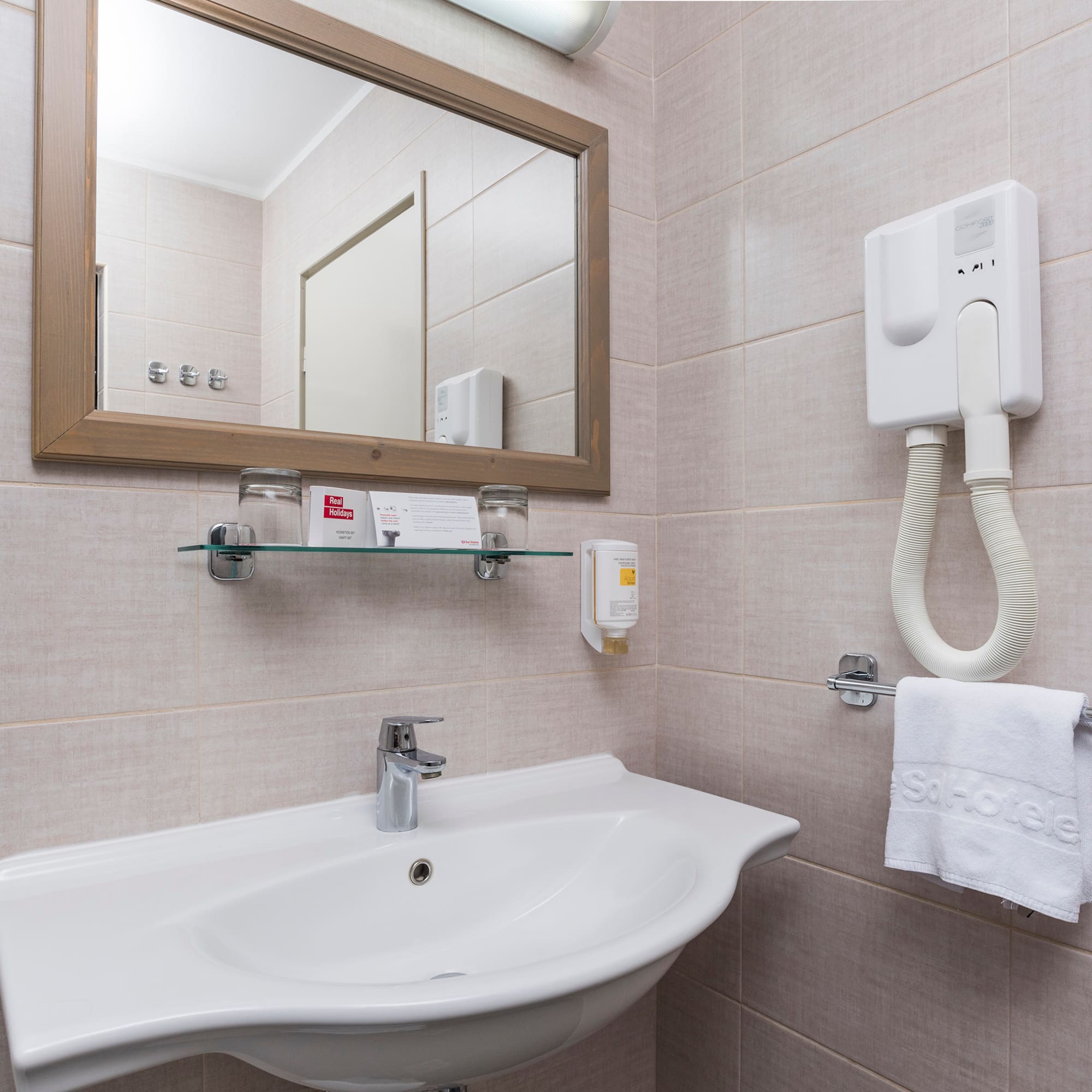 a bathroom with a mirror and sink