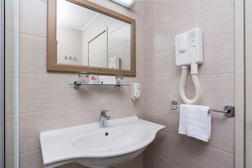 a bathroom with a mirror and sink