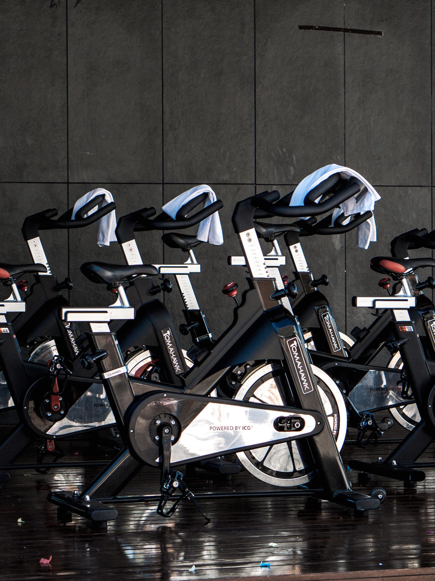 a group of exercise bikes in a room