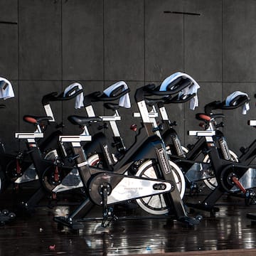 a group of exercise bikes in a room