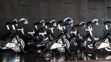 a group of exercise bikes in a room