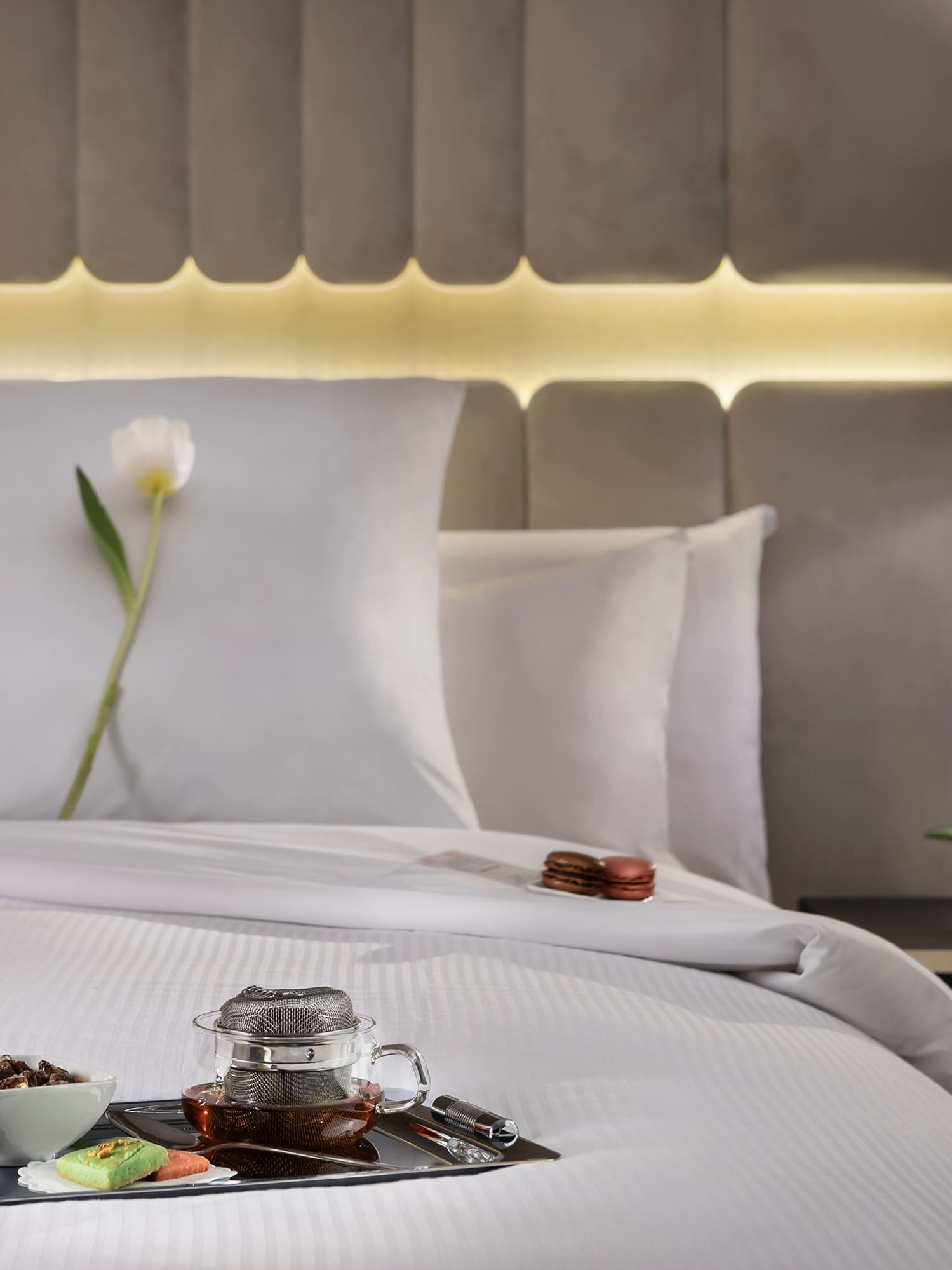 a tray of food on a bed