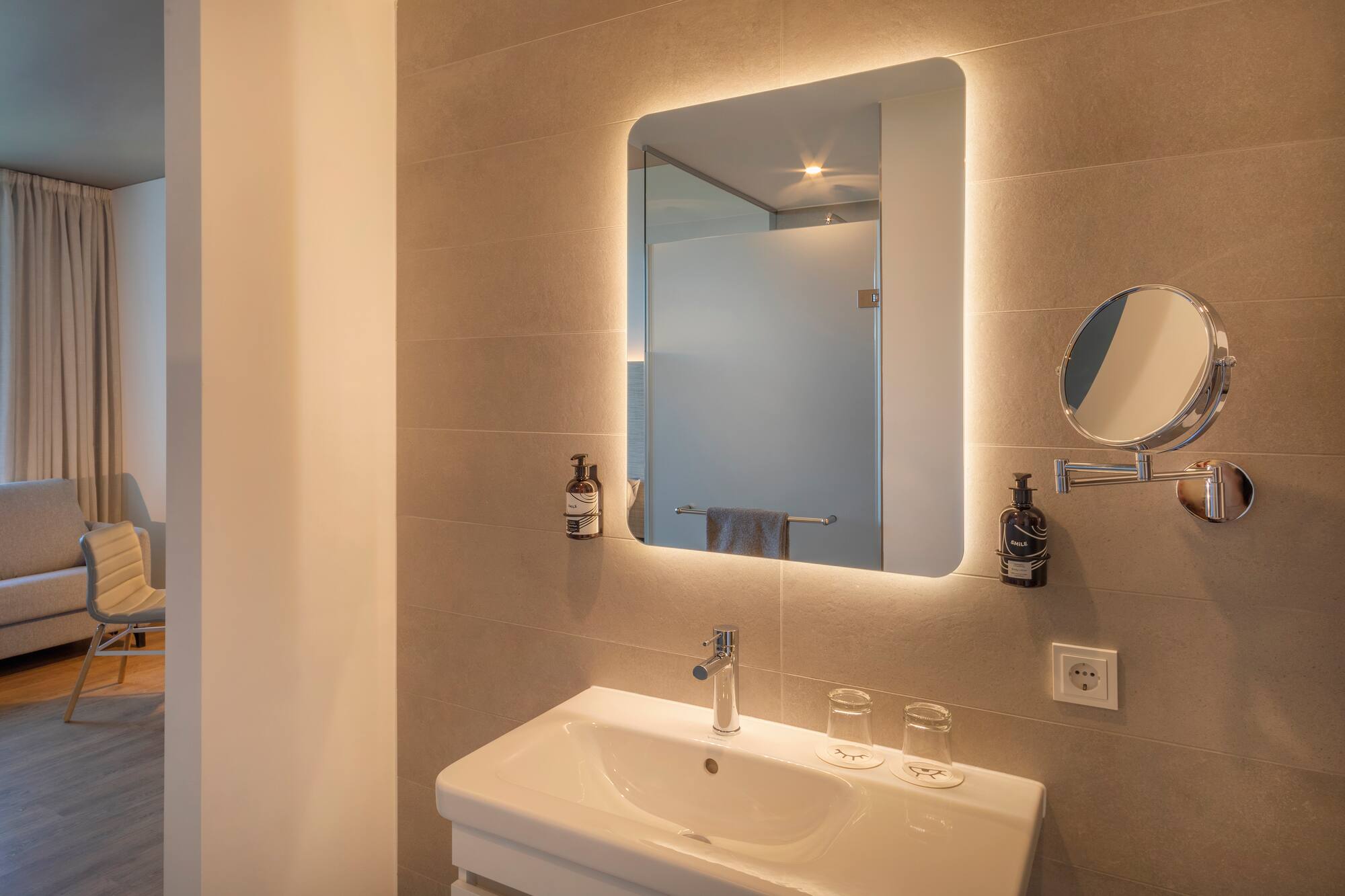 a bathroom with a mirror and sink