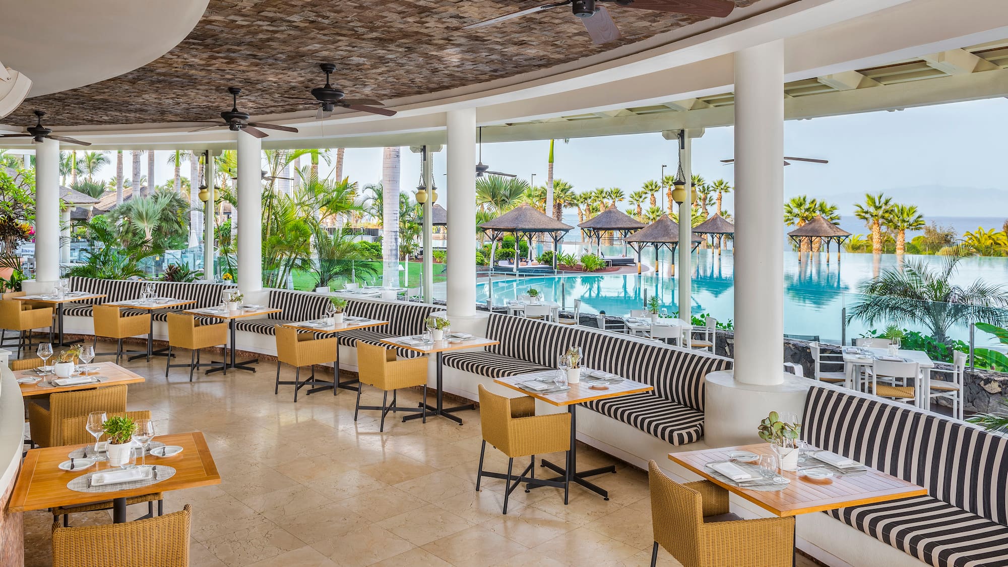 a restaurant with tables and chairs