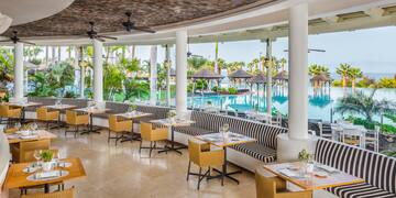 a restaurant with tables and chairs