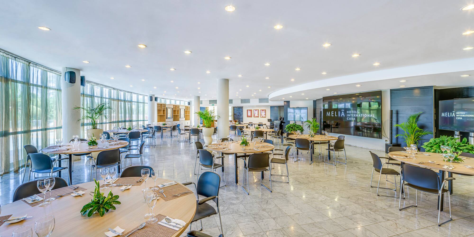 a large room with tables and chairs