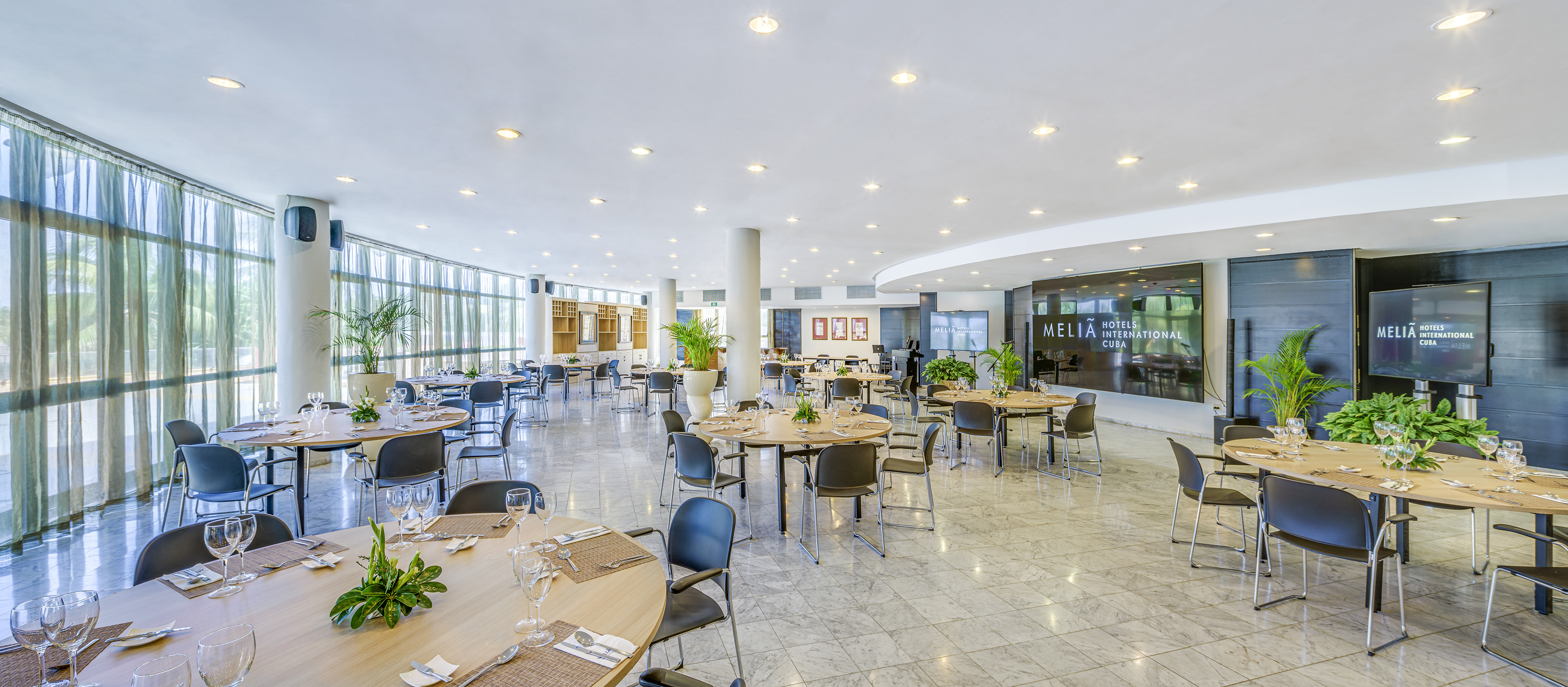 a large room with tables and chairs