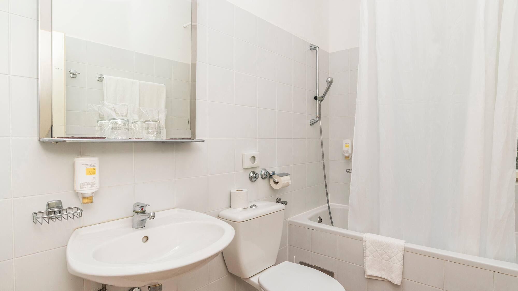 a bathroom with a sink and toilet