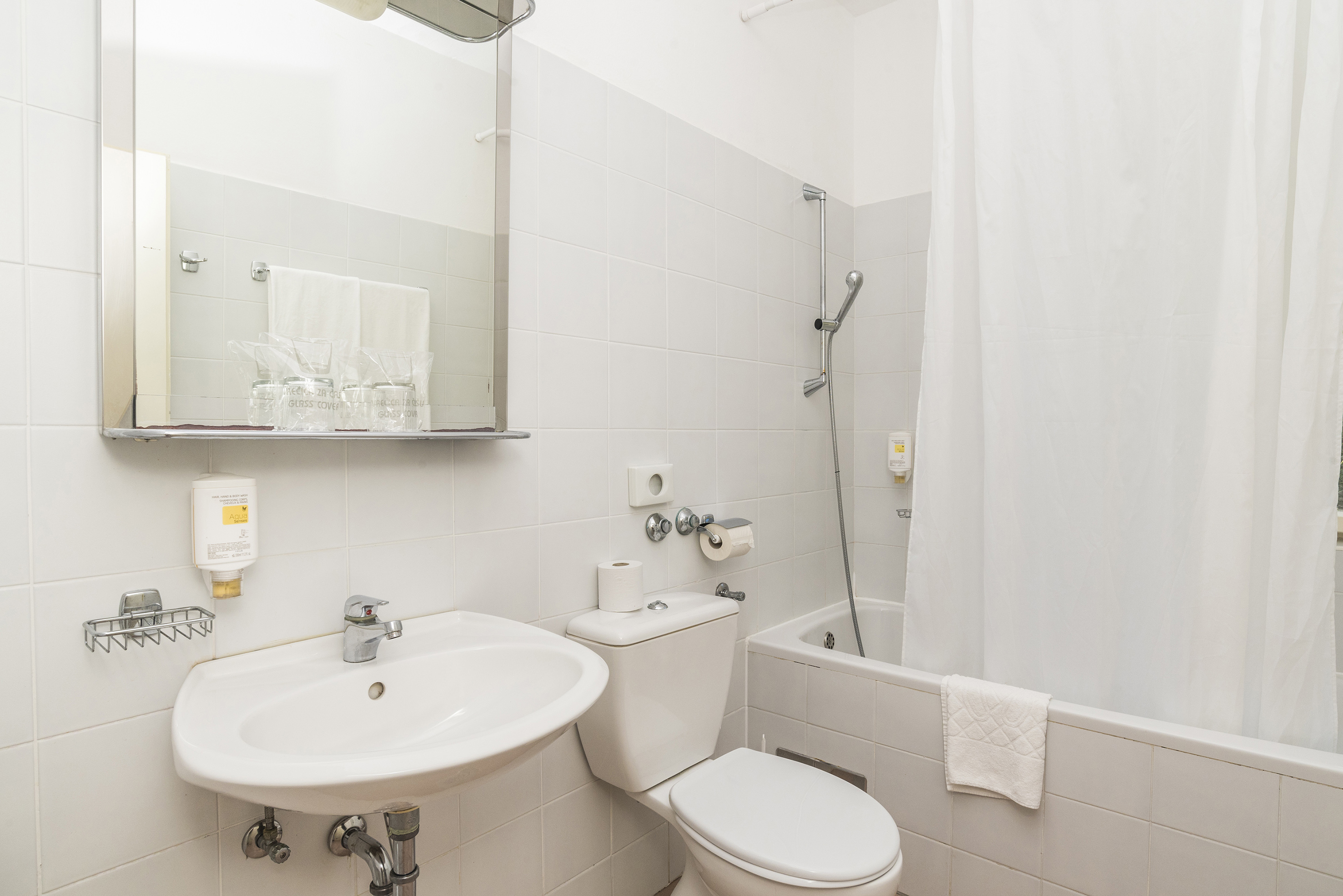 a bathroom with a sink and toilet