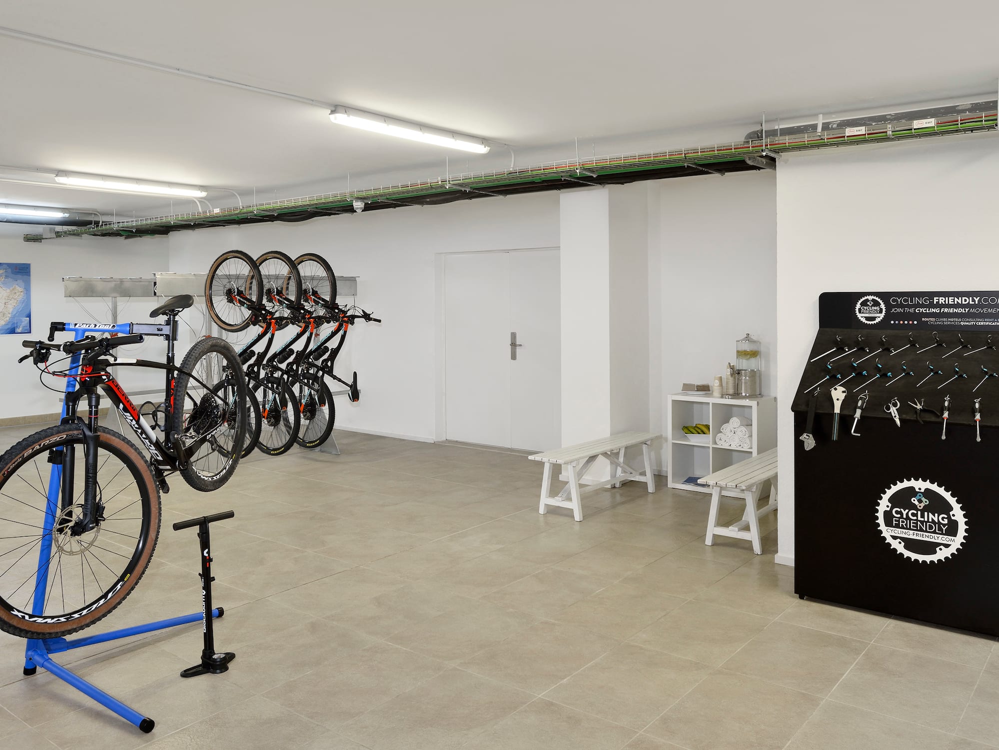 a room with a bike rack and a bench