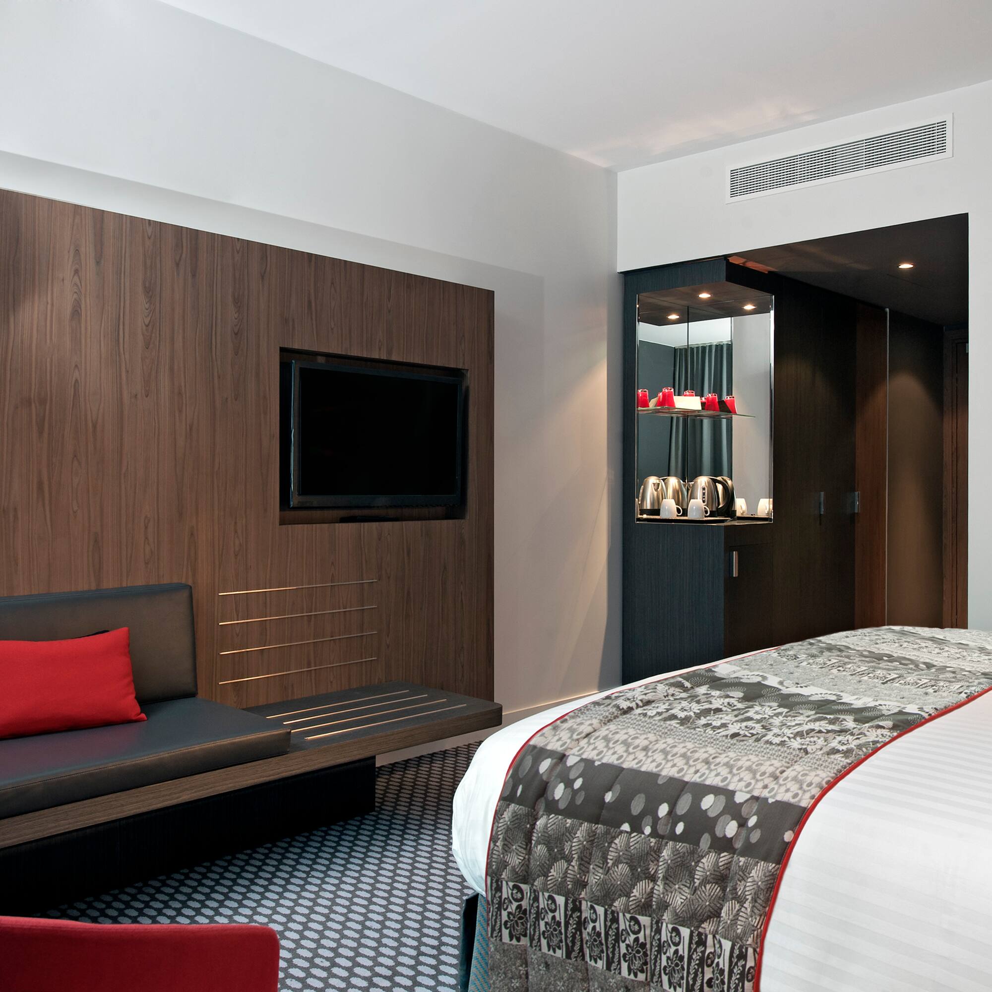 a room with a bed and a tv