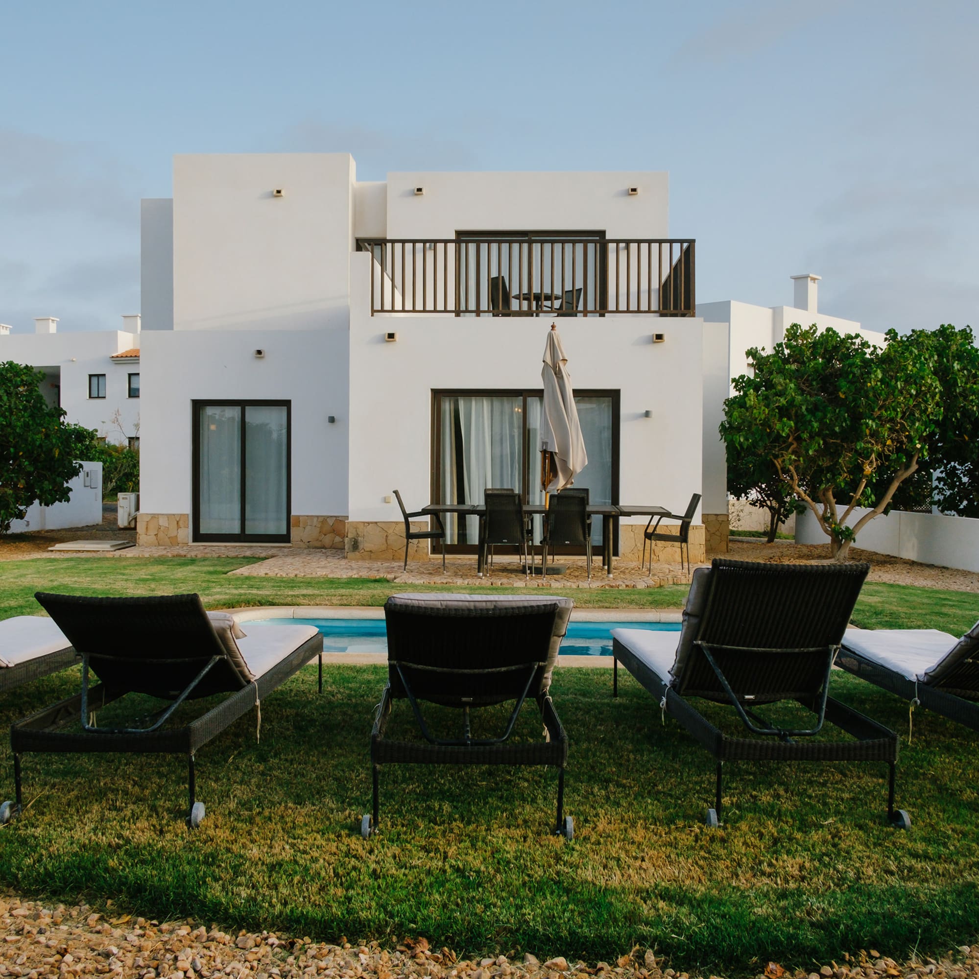 a lawn chairs in front of a house