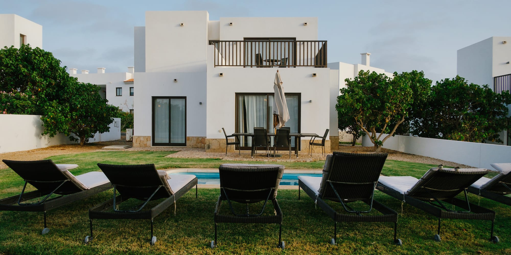 a lawn chairs in front of a house