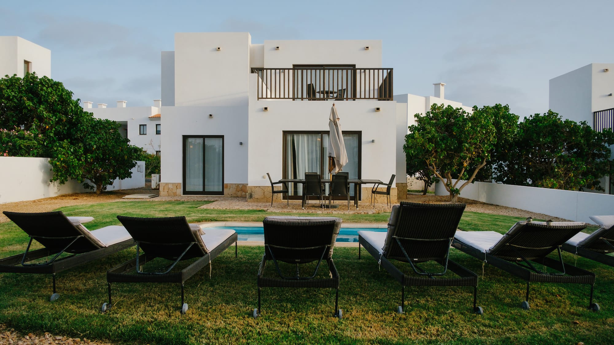 a lawn chairs in front of a house