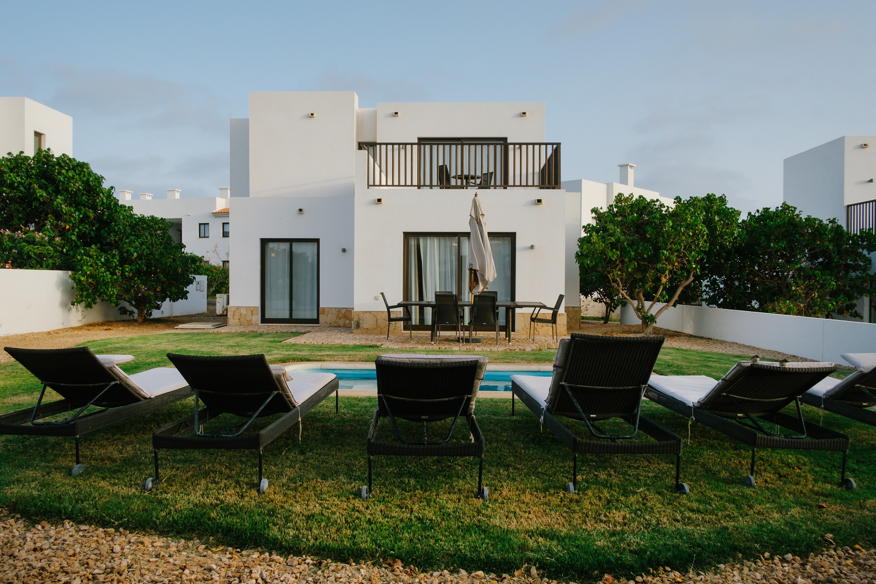a lawn chairs in front of a house
