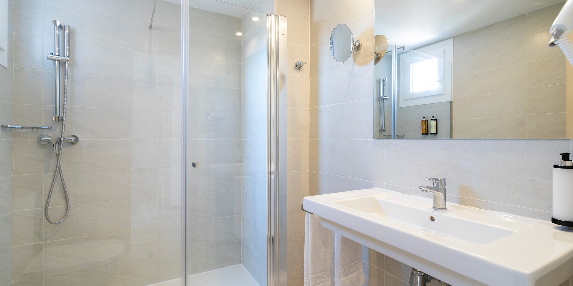 a bathroom with a shower and sink