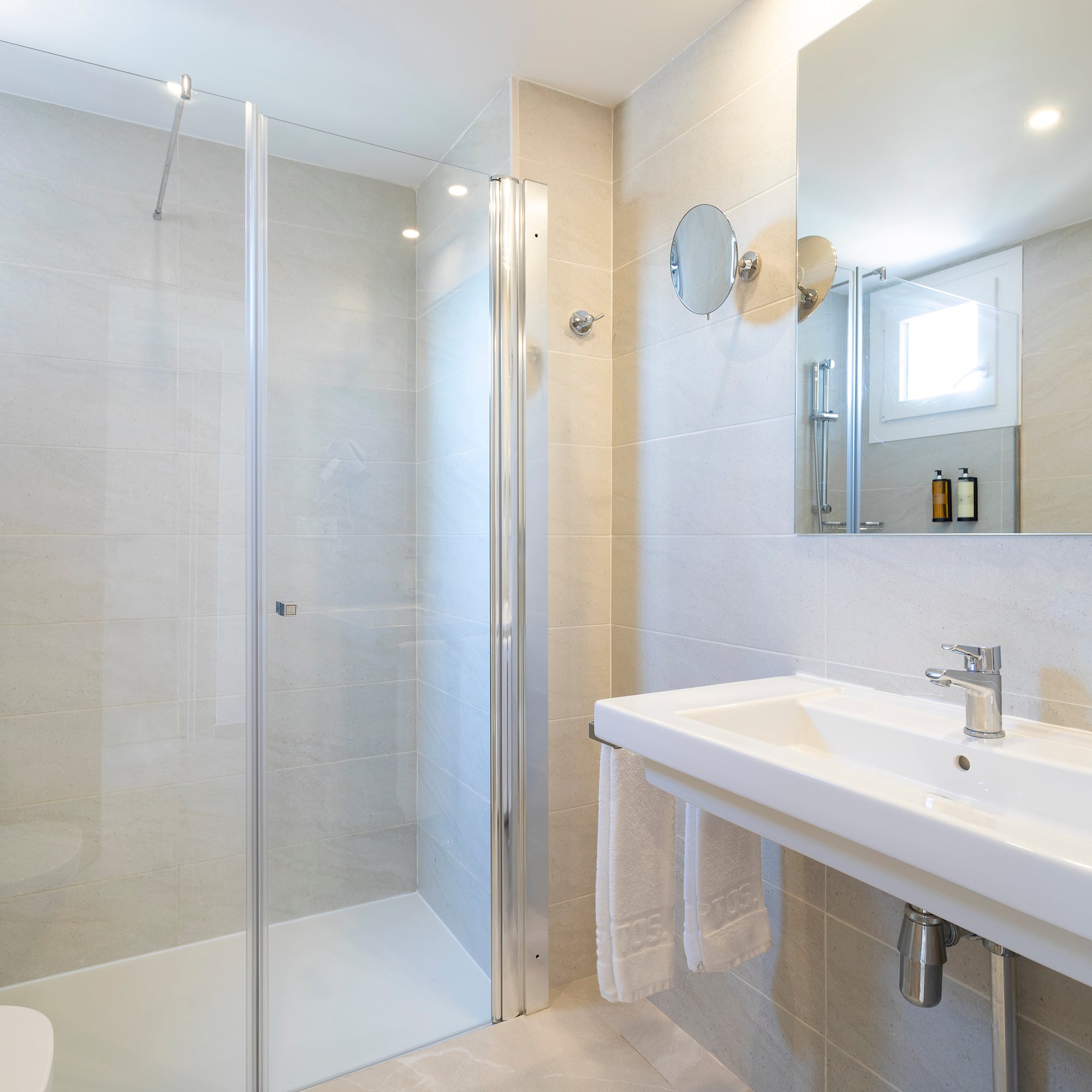 a bathroom with a shower and sink