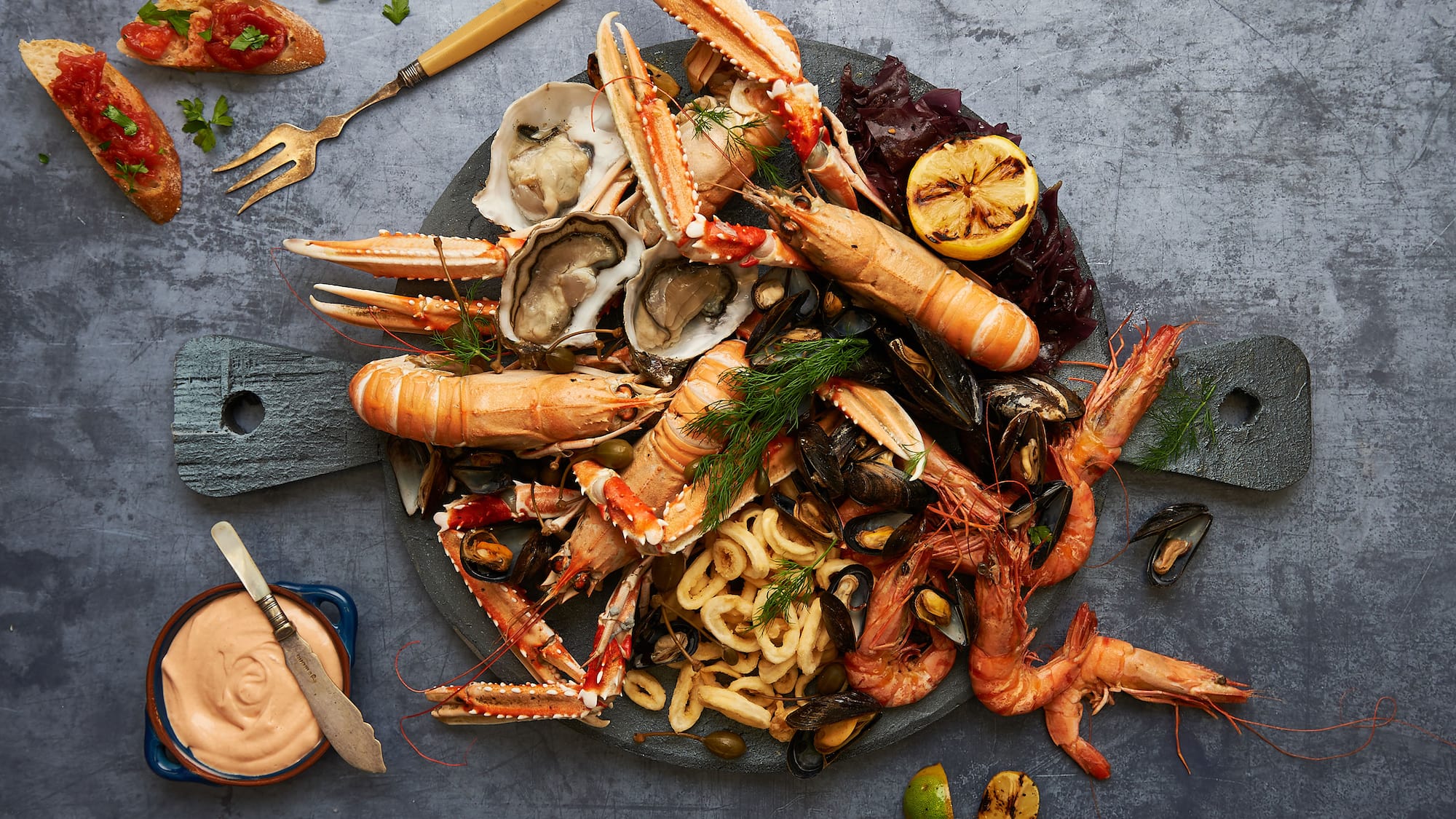 a plate of seafood with a fork and knife
