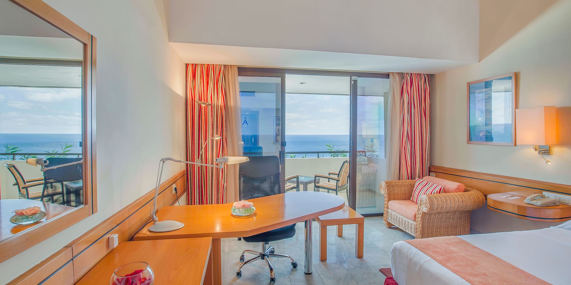 a room with a bed and a desk