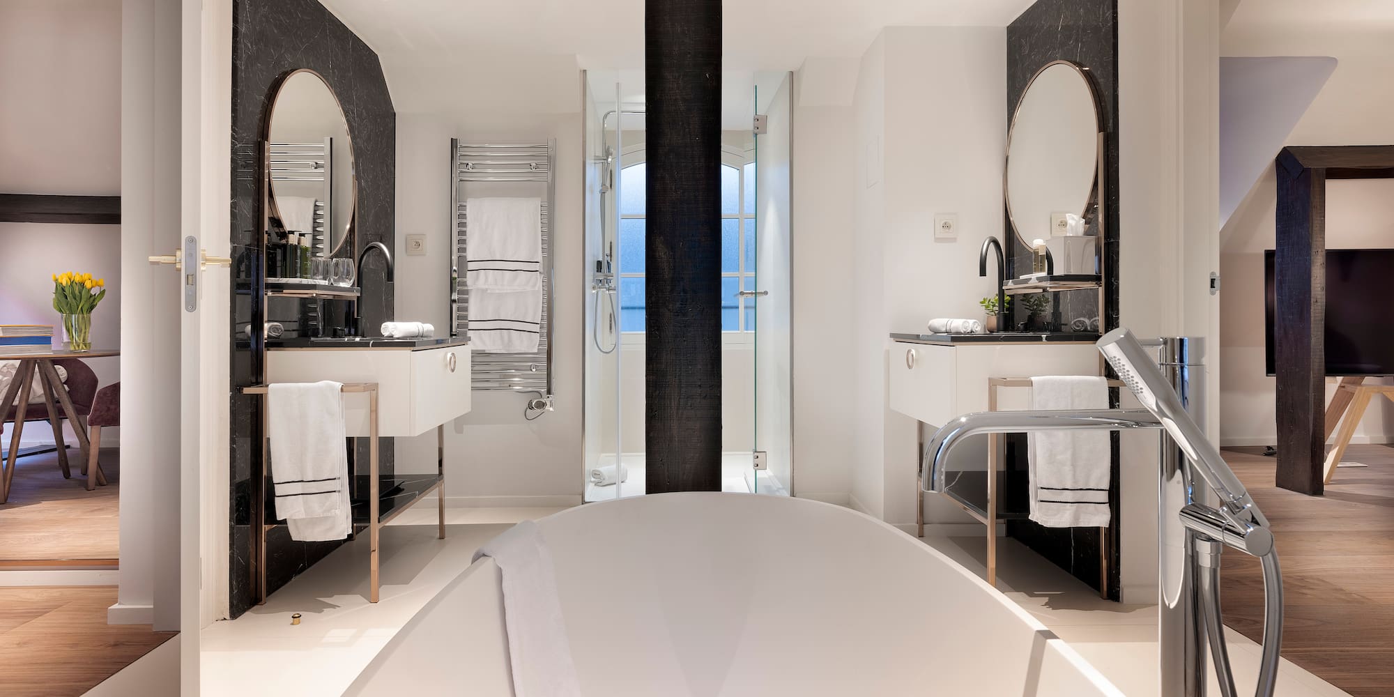 a bathroom with a tub and sink