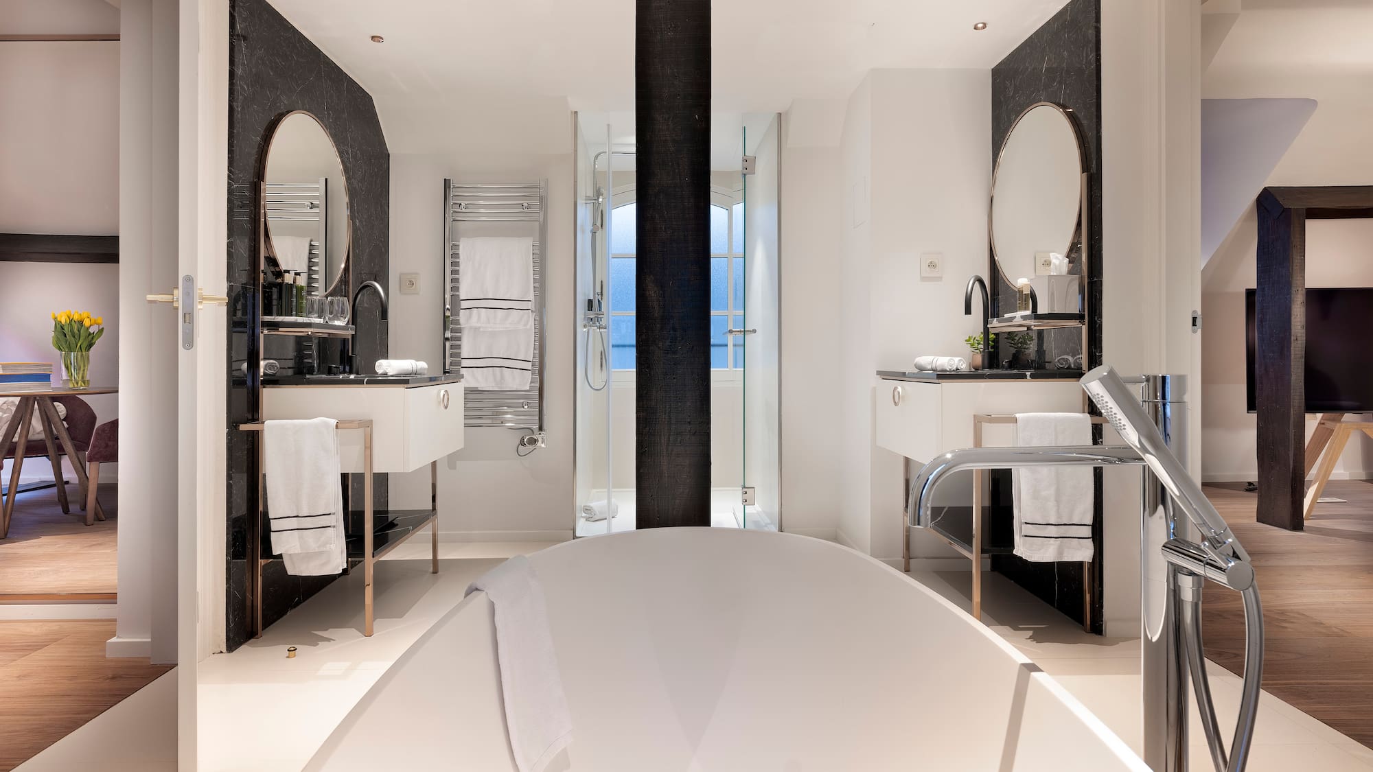 a bathroom with a tub and sink