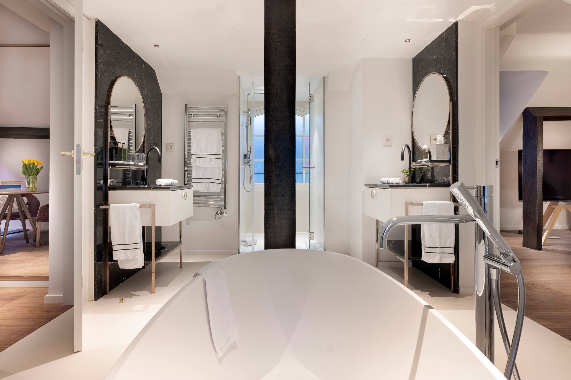 a bathroom with a tub and sink