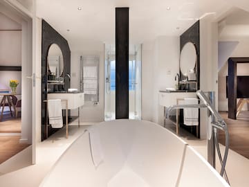 a bathroom with a tub and sink
