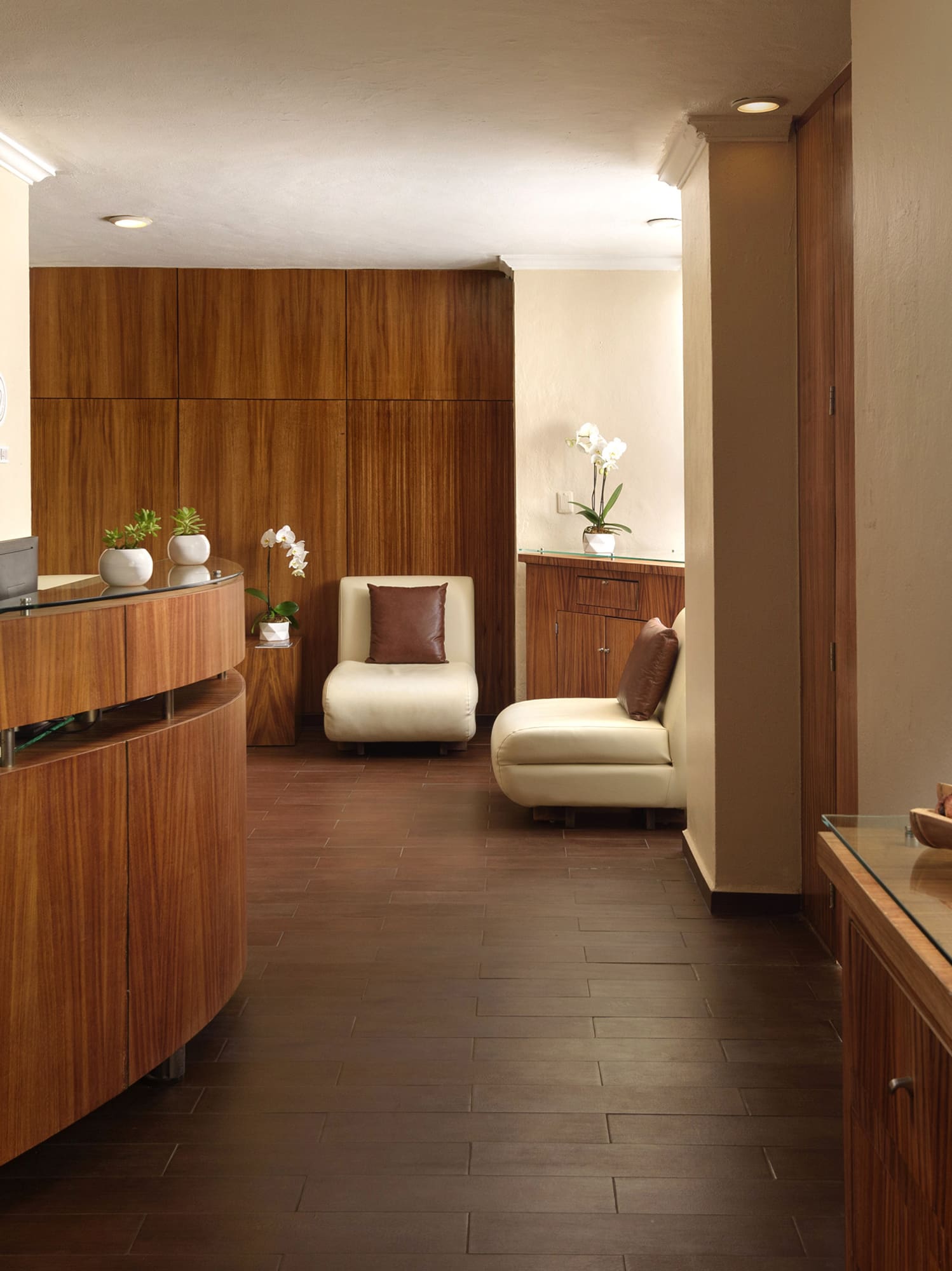 a room with a reception desk and a chair