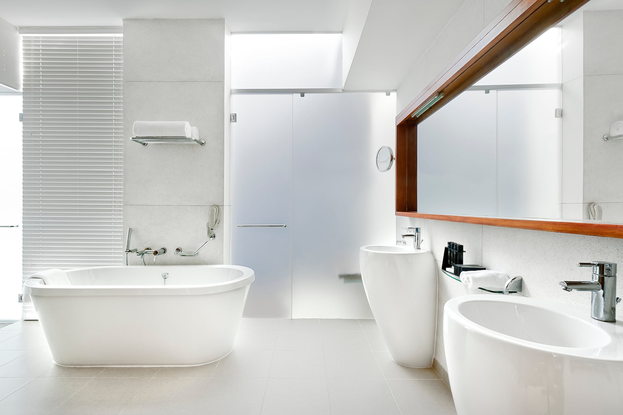 a bathroom with white tub and sink