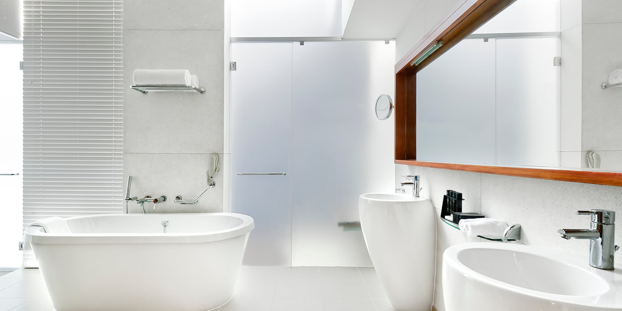 a bathroom with white tub and sink