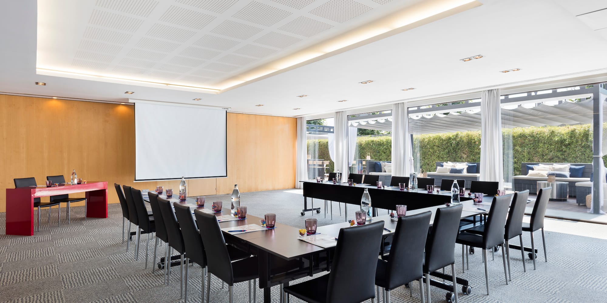 a room with a large table and chairs