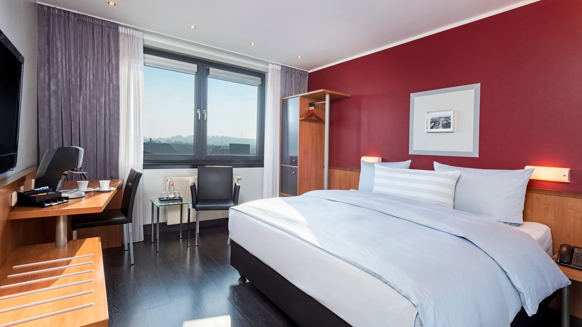 a bedroom with a bed and a desk