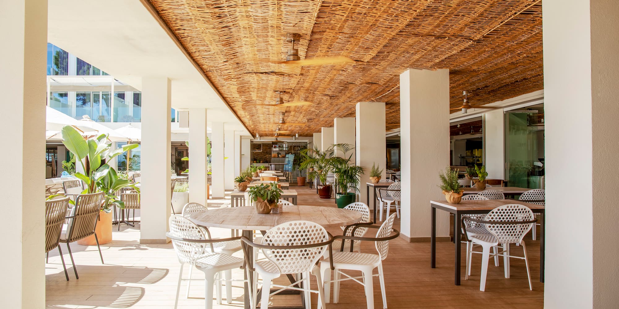 a patio with tables and chairs