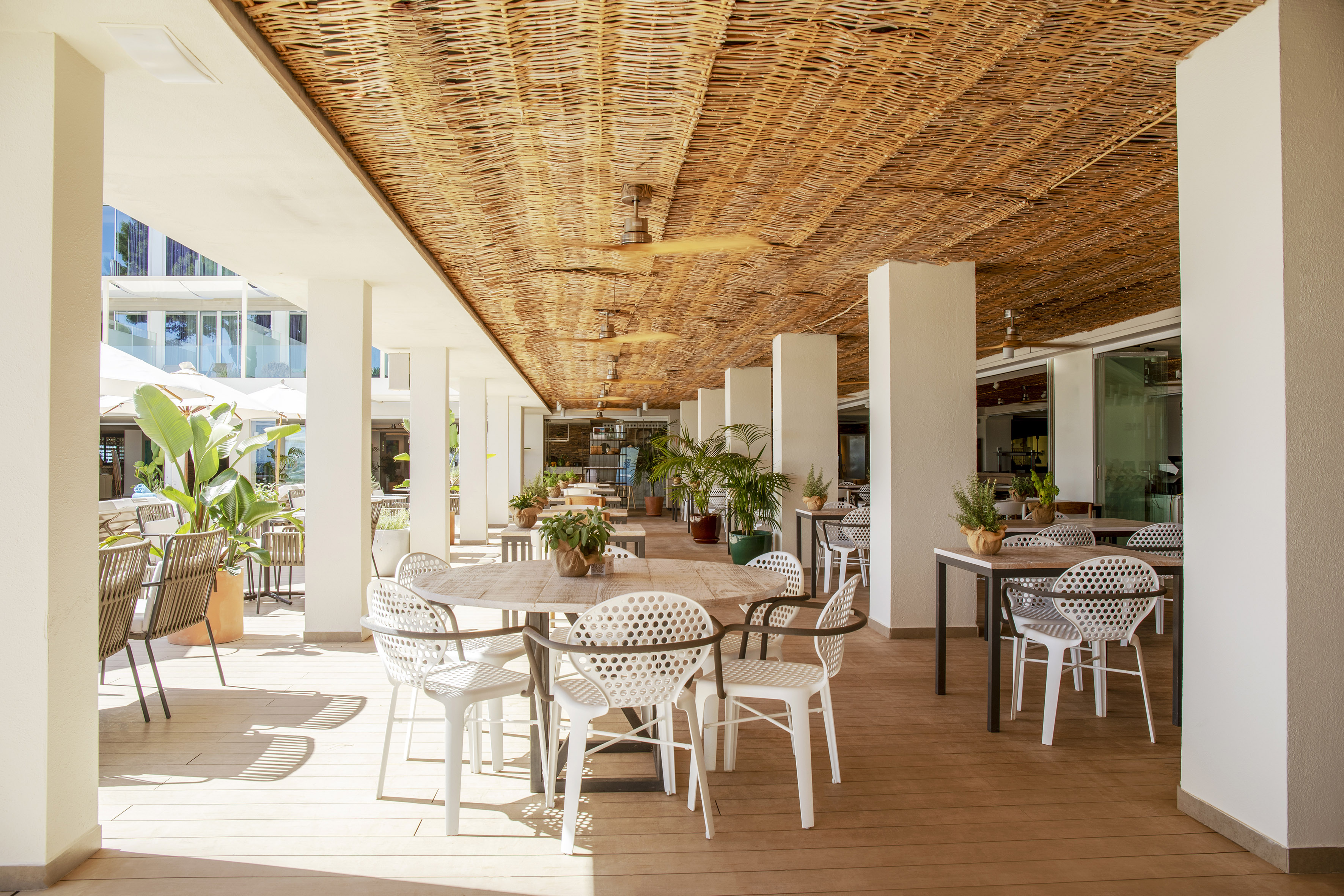 a patio with tables and chairs