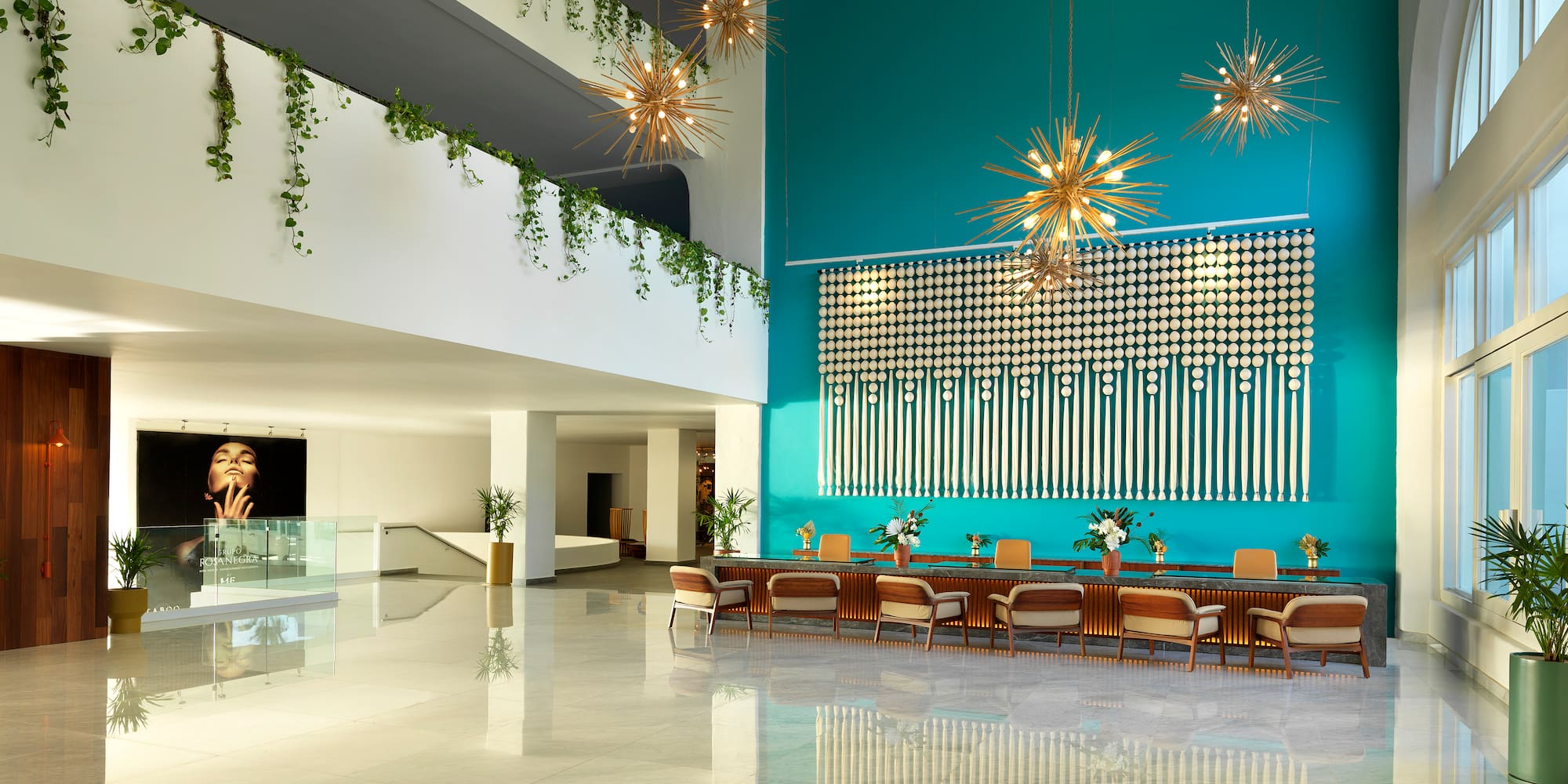 a large room with a large wall and a large staircase