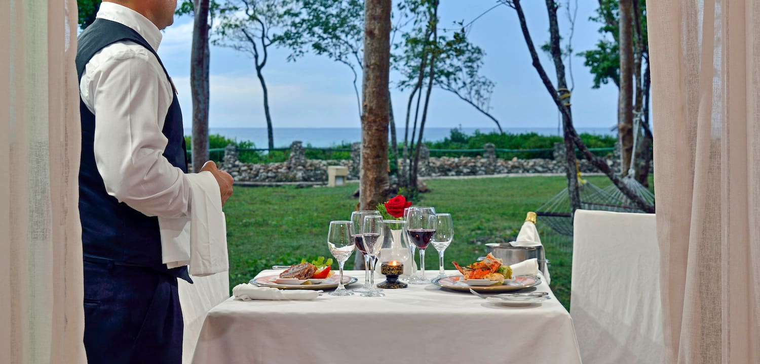 a table with food and wine glasses on it