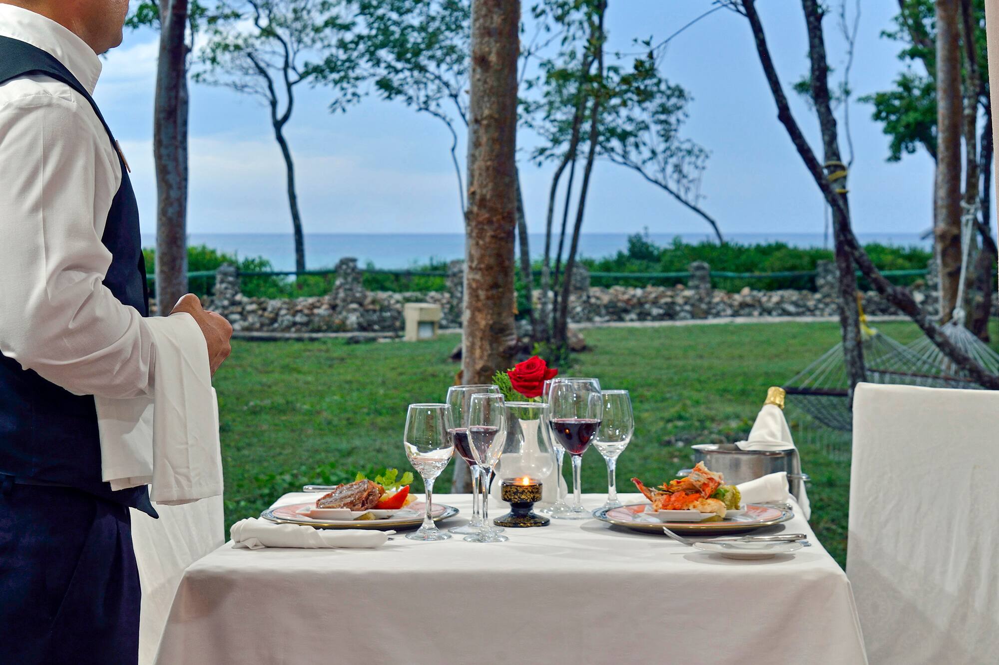 a table with food and wine glasses on it