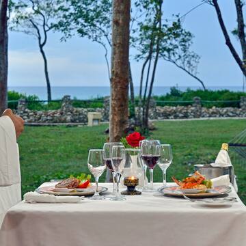 a table with food and wine glasses on it