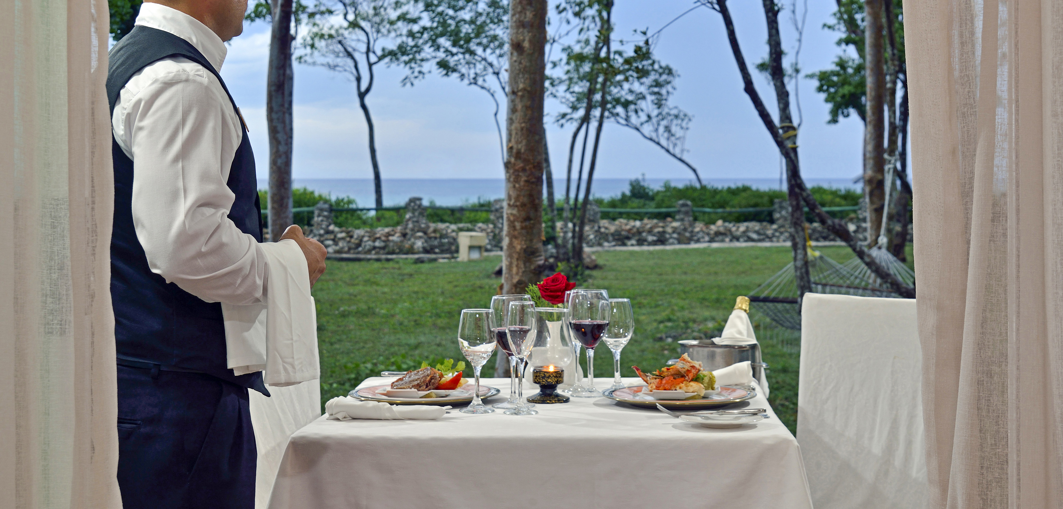 a table with food and wine glasses on it