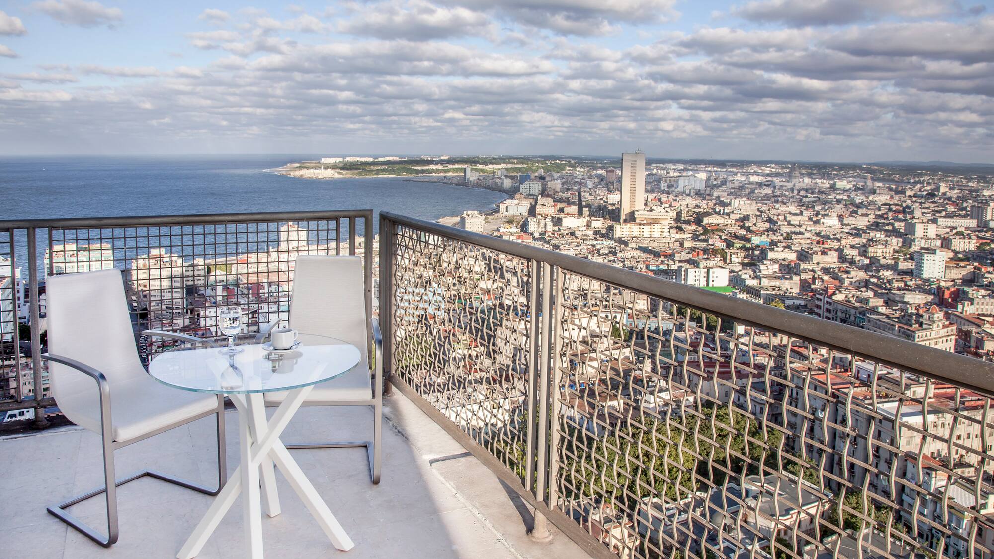 a table and chair overlooking a city