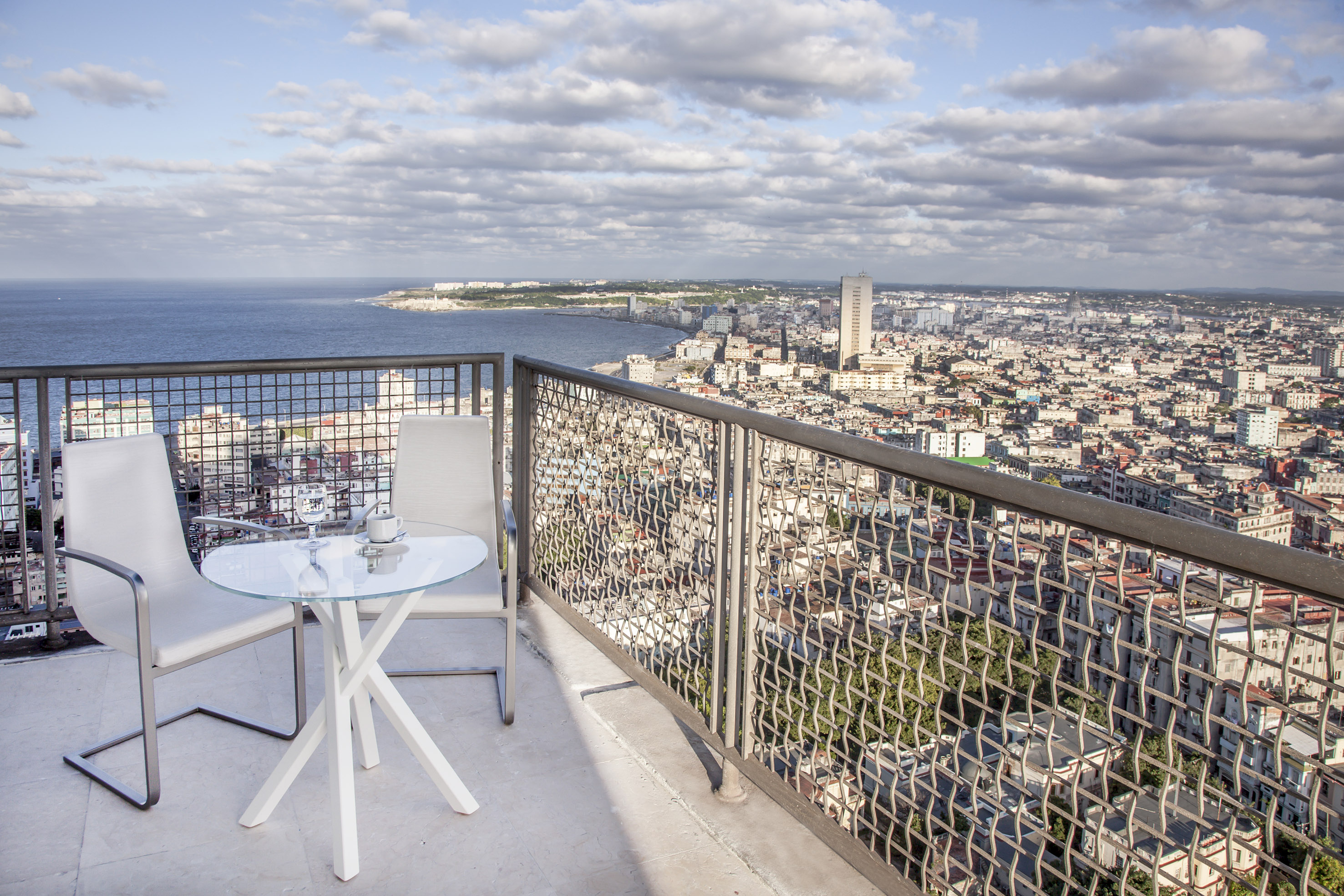 a table and chair overlooking a city