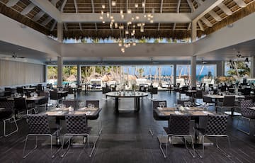 a restaurant with tables and chairs