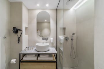 a bathroom with a sink and shower