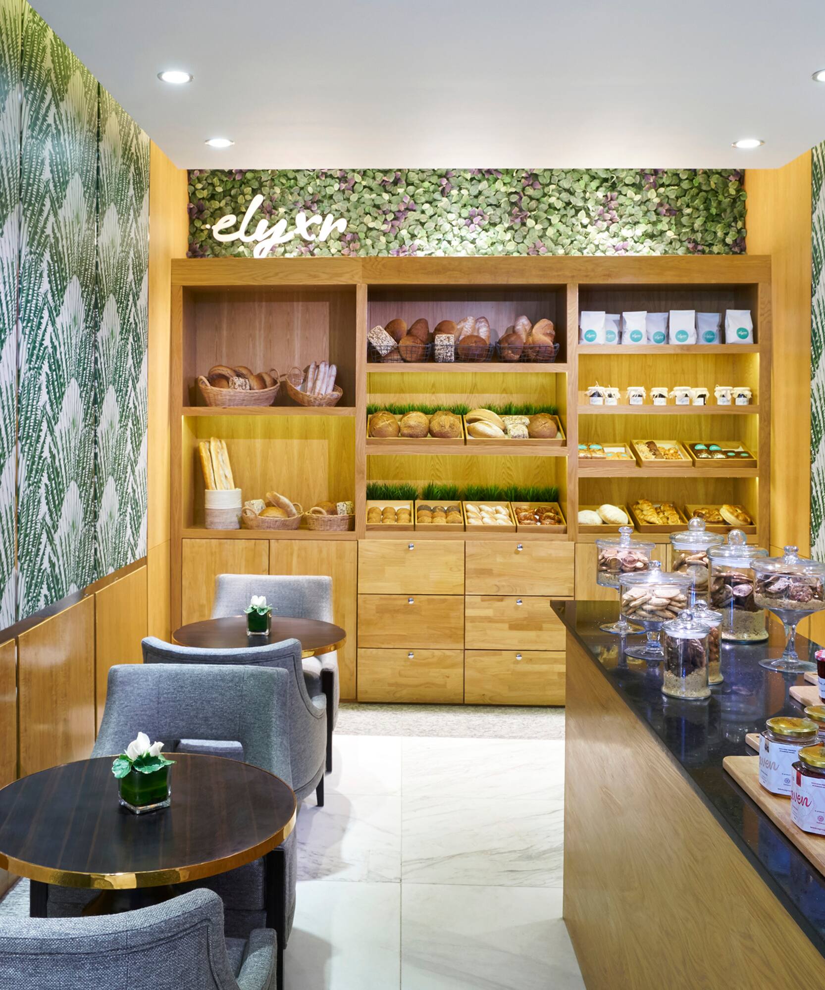 a room with a counter and shelves with food