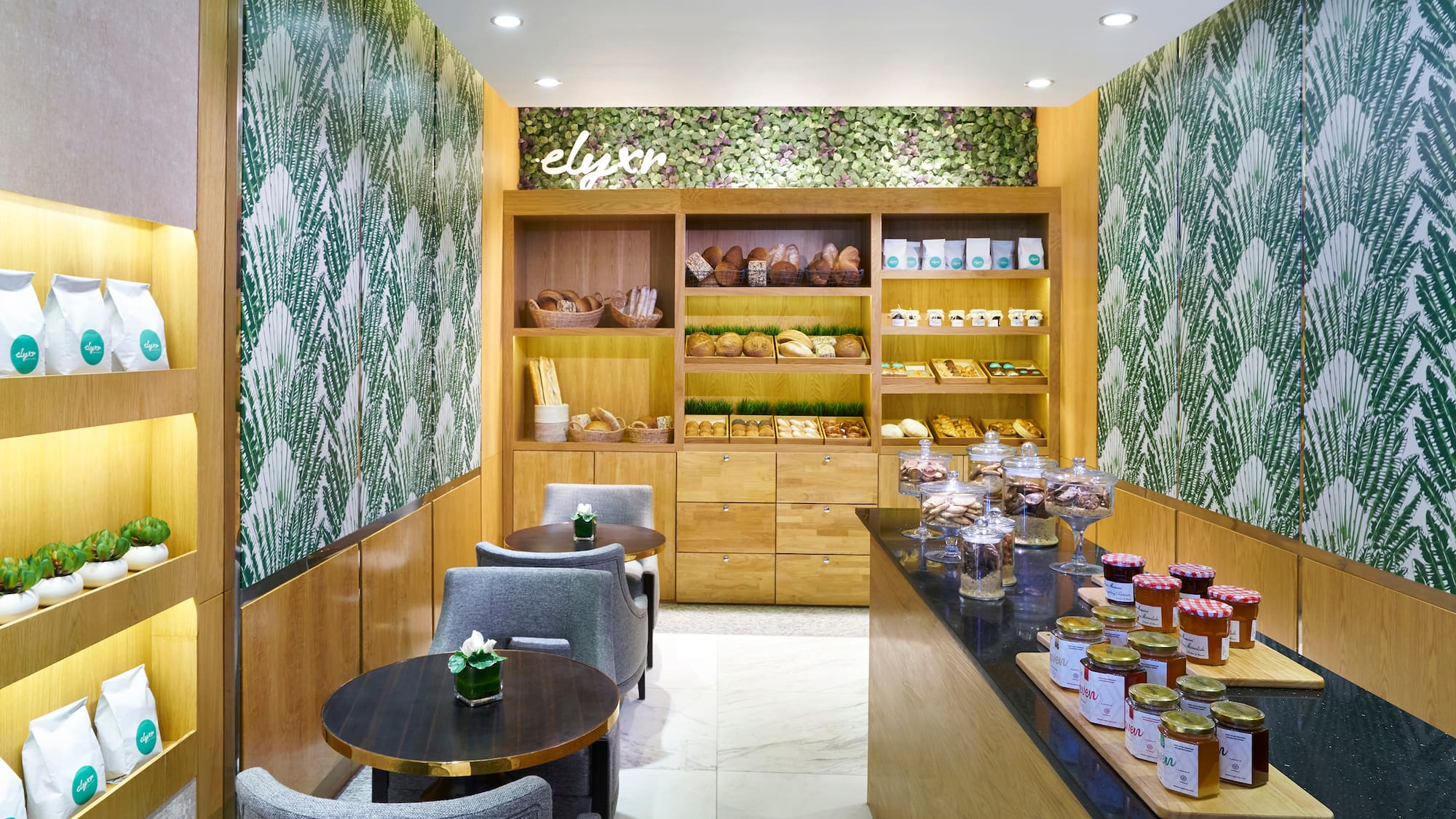 a room with a counter and shelves with food