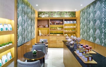 a room with a counter and shelves with food